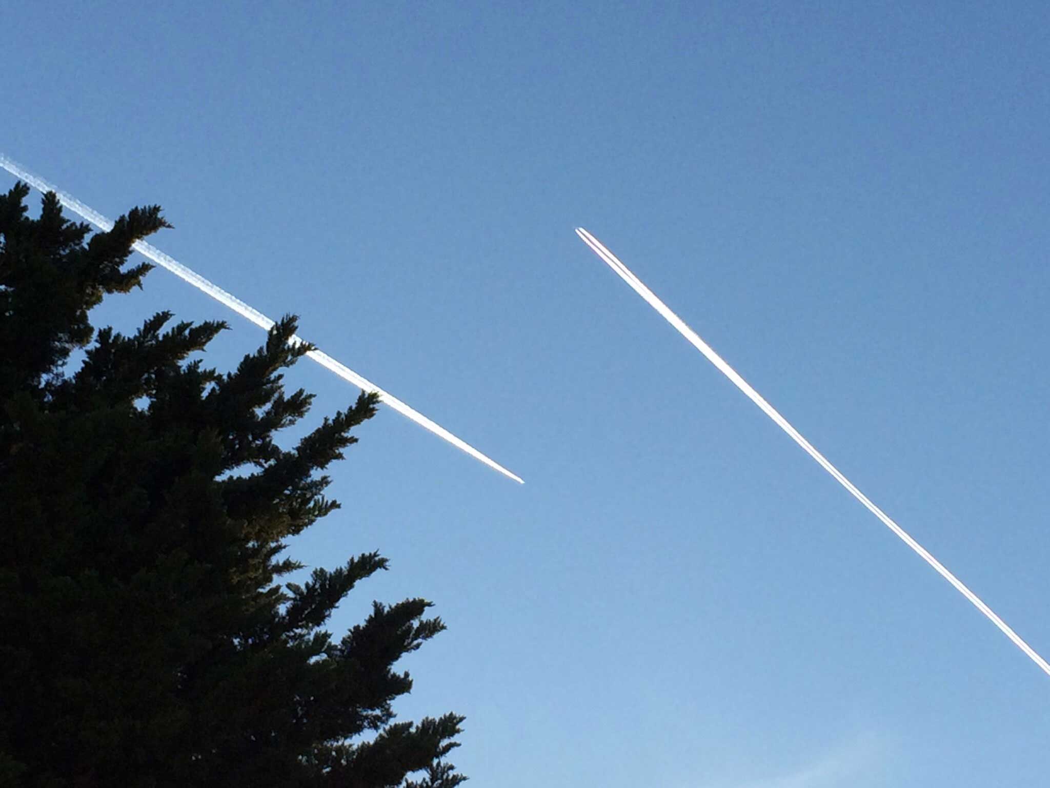 Two planes crossing in the sky